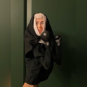 The Fighting Nun vintage punching nun hand puppet